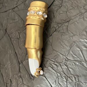 Schiaparelli golden finger ring